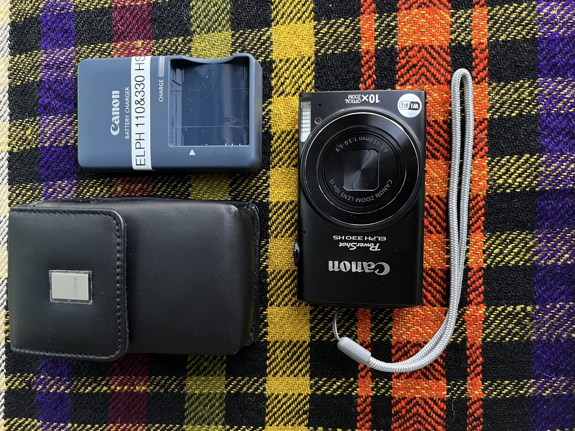 Excellent Canon PowerShot ELPH 330 HS in shiny black finish