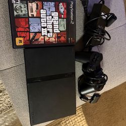 Ps2 slim whith 2 games grand theft auto 3 and kessen