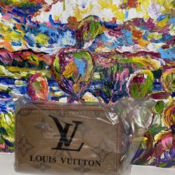 Louis Vuitton Monogram Zippy Coin Purse in brown PVC and leather. 