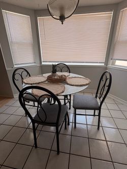 Glass round table with 4 chairs