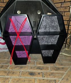 Grey spider web coffin shelf