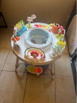 Skip Hop activity center with extra toys
