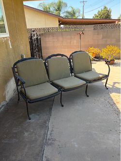 Black metal patio bench