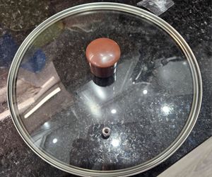 New, never used 10in glass pan and pot lid.