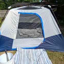 6 Man Instand Pop Up Cabin With A Light Fixture At The Top