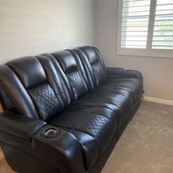 Black leather electric reclining couch  with usb and power plugs