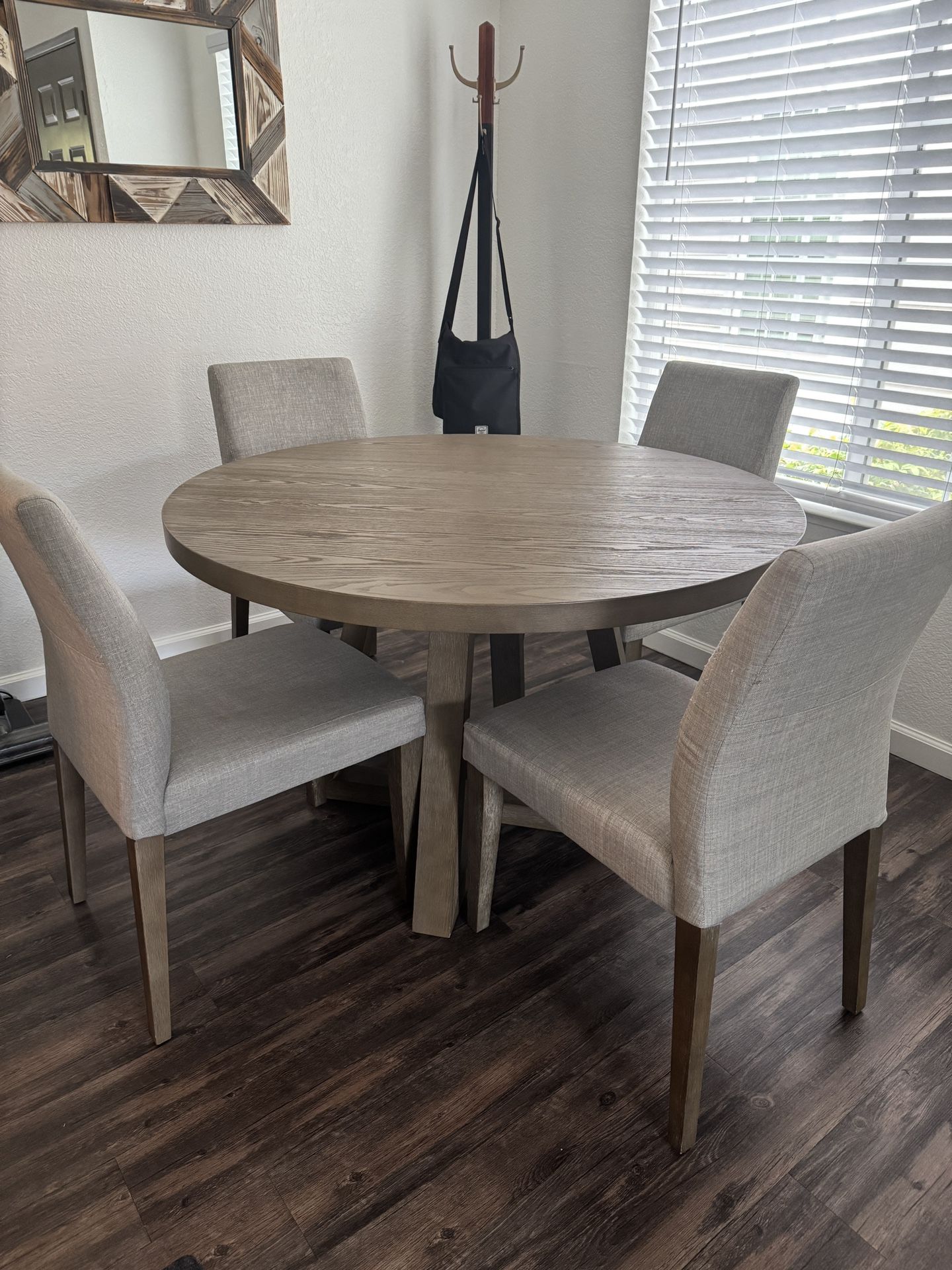 Round Dining Table with Upholstered Chairs