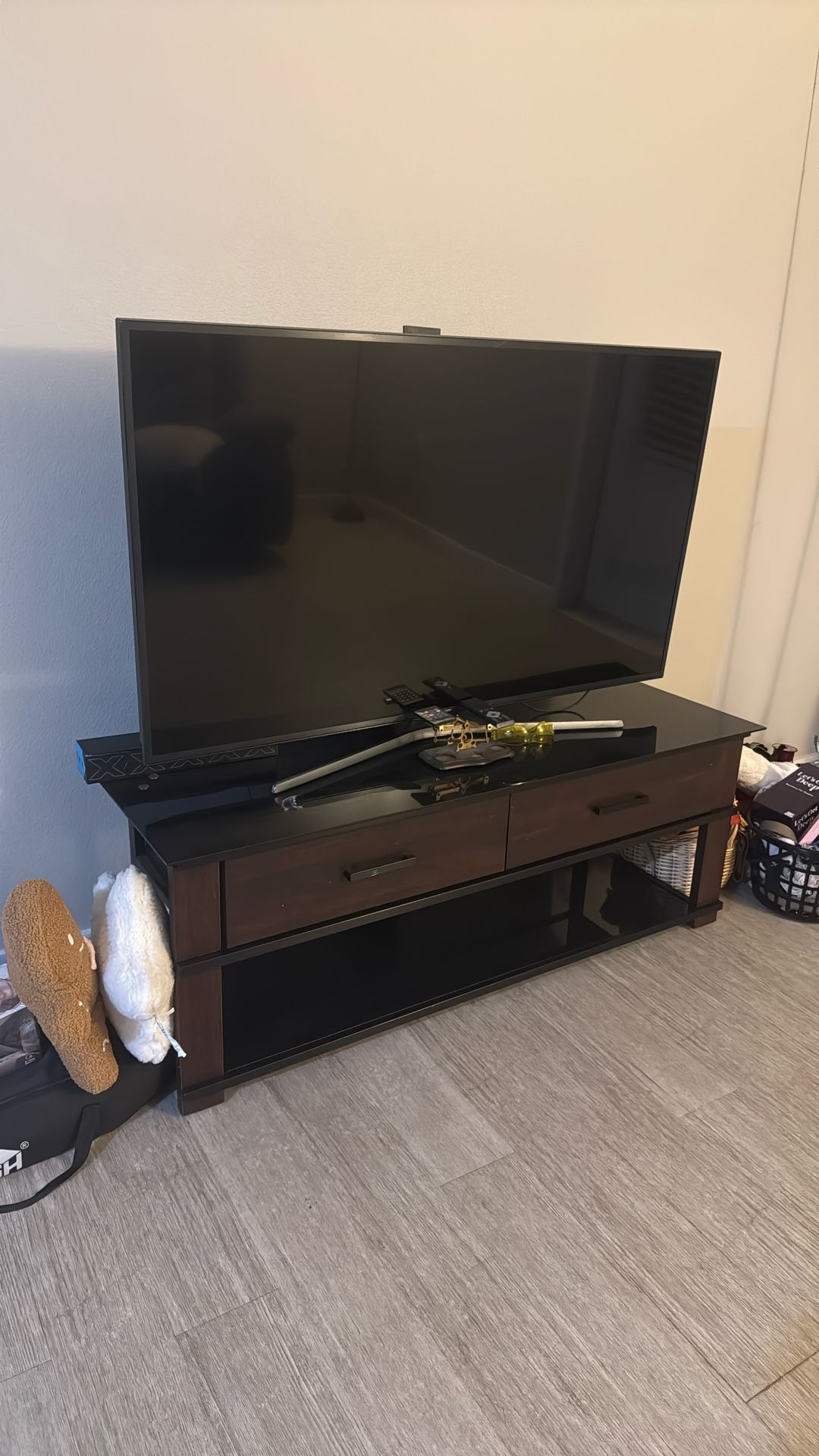 55” TV AND AN ENTERTAINMENT CENTER