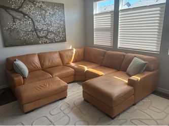 Beautiful leather sectional with chaise and ottoman, one year old, like new!!