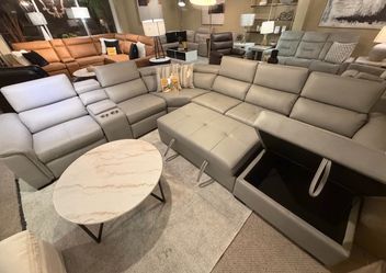 Grey or taupe wraparound with pullout bed and storage chaise ( Modern Home Furniture)