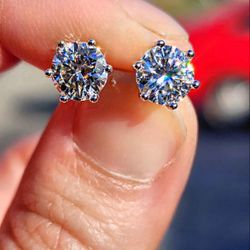 2 Carat Moissanite Round 18kt White Gold Plated Sterling Silver Stud Earrings.