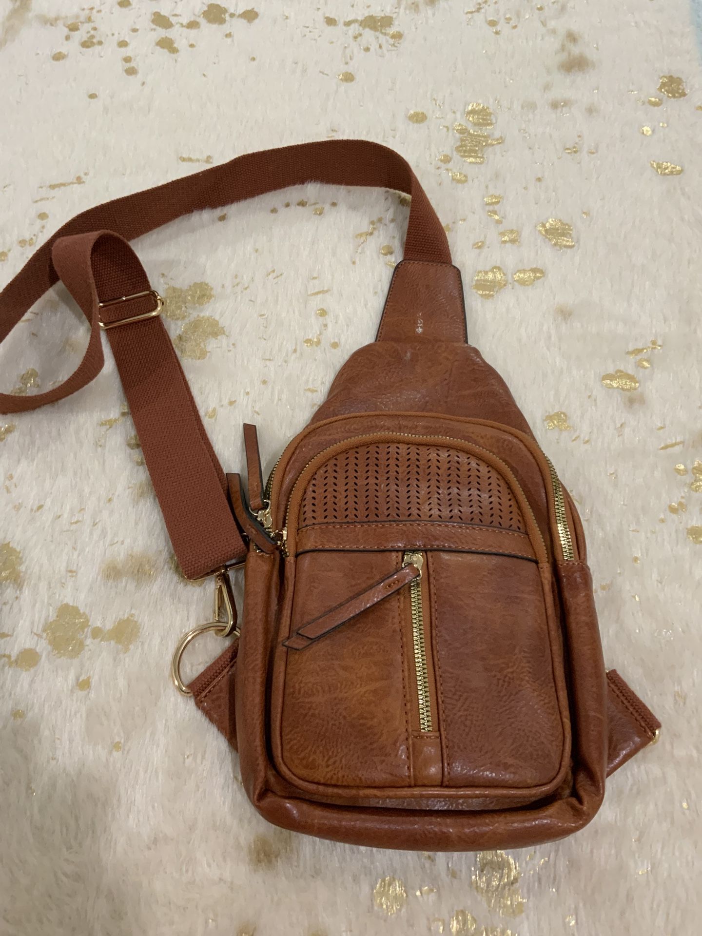 Leather sling bag. Medium size. Like new. Smoke free home. No holds. No shipping.