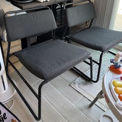 A pair of wide bottomed IKEA lounge chair