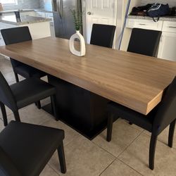 Brand New Black and Wood Table Still In Box. CHAIRS NOT INCLUDED.  Dimensions are 31.5x 63 And Has An Extender Which Can Make It 78.7 