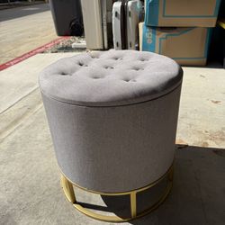 Round upholstered ottoman with storage