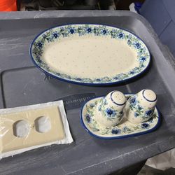 Polish Pottery (Bolesławiec) stoneware pieces.  The large item on the right is an oval platter or baker.  The items on the left are a salt and pepper 