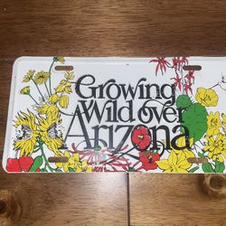 Vintage Growing Wild Over Arizona decorative metal license plate 80s