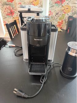 Nespresso with milk frother and pods
