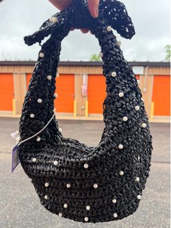 Chic black woven handbag with pearl embellishments. Bag has zipper closure and Haute Hippie brand tag inside.