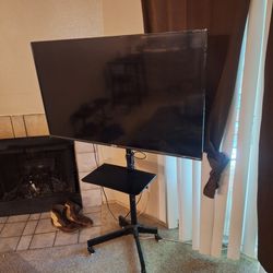 TLC Roku 55" Television, Mobile Stand, Two Attachable Legs and Remote 
