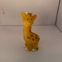 Yellow giraffe with brown spots