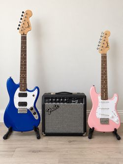 2 Squier Electric Guitars + Fender Amp, Stands & Straps