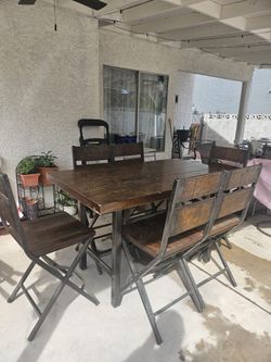 Ashley's High Dining table with six chairs.