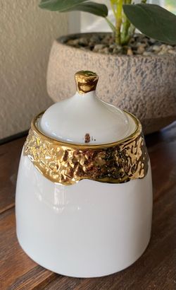 Golden covered sugar dish