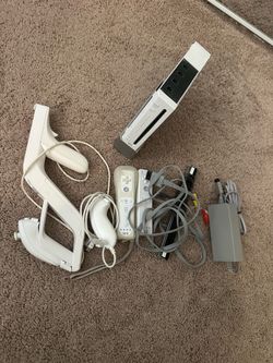 Nintendo Wii with controllers and games