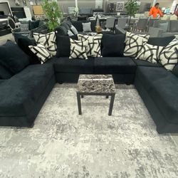111 black sectional with colorful pillow 