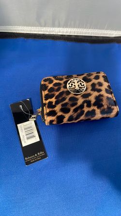 Rebecca & Rifka zip-around wallet featuring a bold brown and black leopard print pattern.