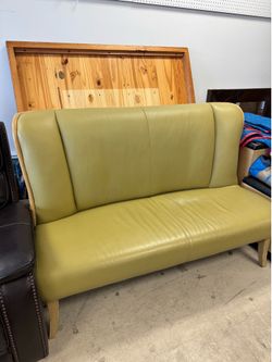 Robb & Stuckey modern light green leather sofa with a high back and tapered wooden legs