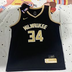 Milwaukee Bucks Player AntetokounmpoNumber 34 Wears A Black Jersey
