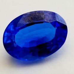 10.02 Ct Loose Clear Blue Zoisite Tanzanite-Like Excellent Oval Cut Gemstone. Dimensions are approximate. The product is a 10.02 Ct loose clear blue Z