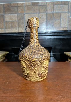 Vintage Spanish hand-tooled leather-wrapped liquor or whiskey decanter