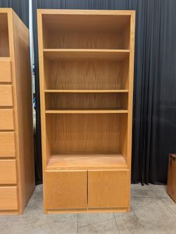 Light Brown Wood Bookcase with Three Shelves and Lower Cabinets