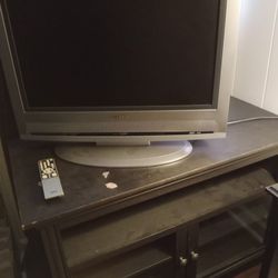 T.V Is Flat And Works Excellent And Stand BOTH $50
