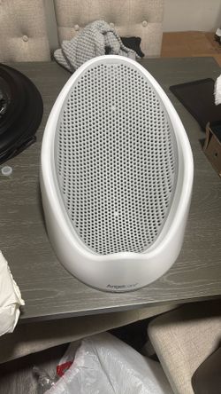 Baby Bath With An Open Diaper Pack Of Huggies 2