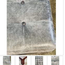 Grey Leather Button Tufted Ottoman On A Dark Wood Base