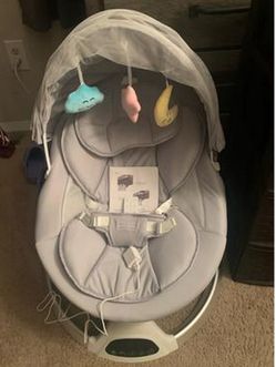 Like new Baby Swing  w/ Canopy & Toys 