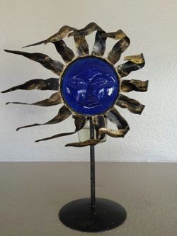 METAL AND GLASS SUN CANDLE HOLDER