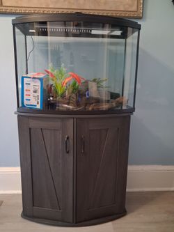 Like new fish aquarium with stand and rocks and accessories cash only
