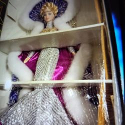 Barbie dolls, perfect inbox never been out.The striping one's two hundred and the first one's two hundred , the gold one is a hundred