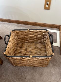 Large wicker basket with metal handles