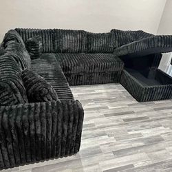 Black Fabric Sectional with Pull-Out Bed with Storage. Brand New.