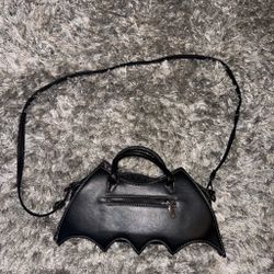 black bat-shaped PU leather handbag with embroidered spider web details