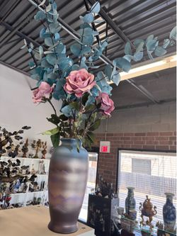 Vase with flower arrangement