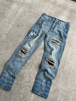 Light Wash Distressed Jeans with Embroidered Patch
