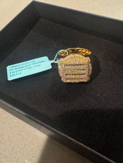 Brand new iced-out moissanite ring.