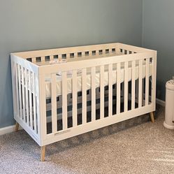 Delta Children Essex 4-in-1 Convertible Baby Crib, Bianca White with Natural Legs
